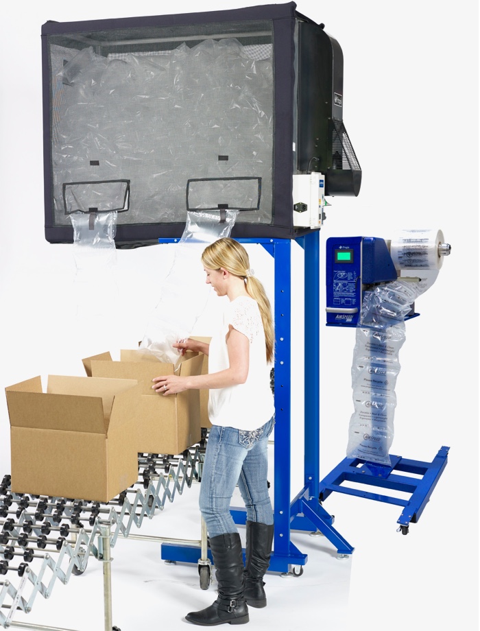 Employee using machinery to package goods.